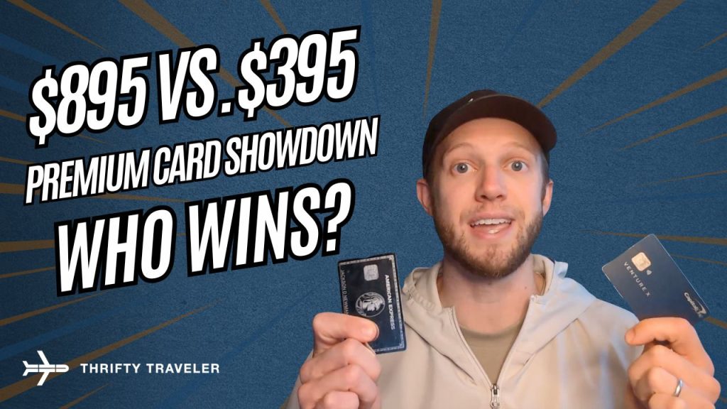 A person holding an Amex Platinum and a Capital One Venture X Credit Card.