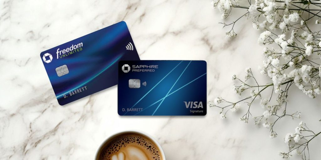 Freedom Unlimited and Chase Sapphire Preferred cards with a cup of coffee and floral arrangement on a marble background