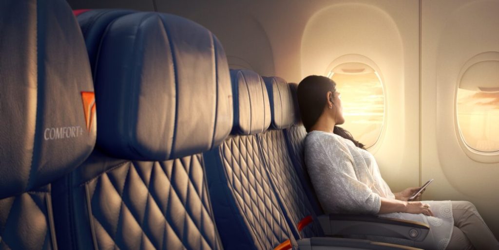 delta passenger looking out the window