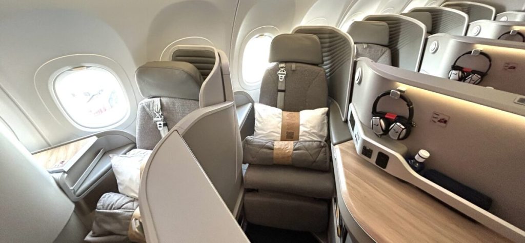Iberia A321neo business class seats and cabin with food finishes and gray interiors.