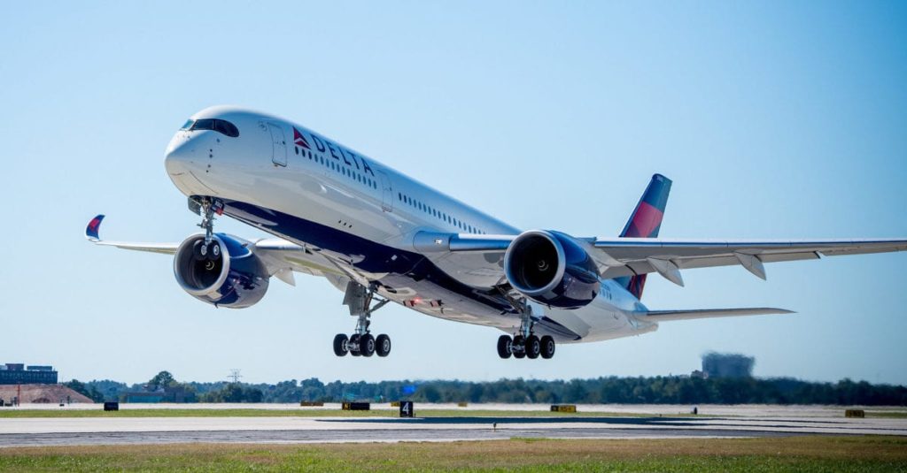 A Delta a350 taking off from the runway.