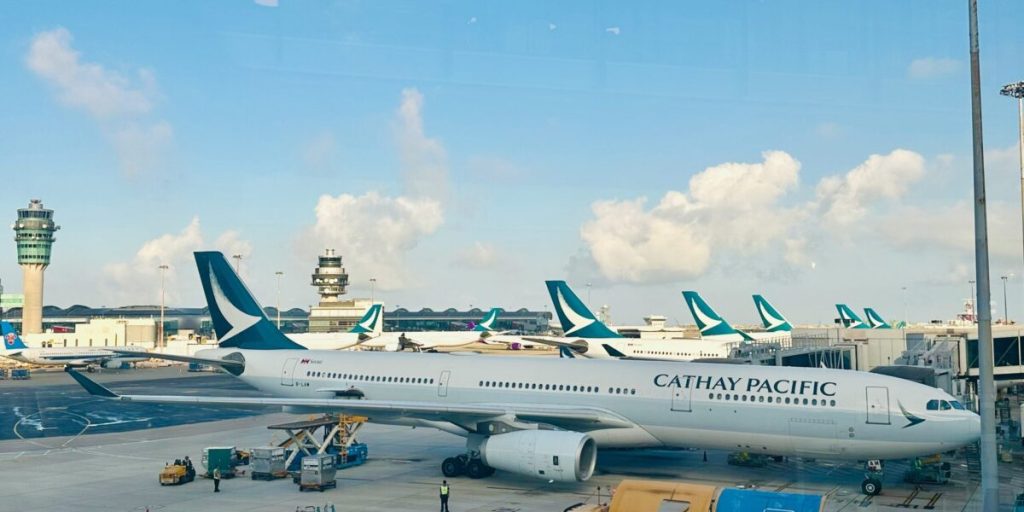 cathay pacific planes parked at gate