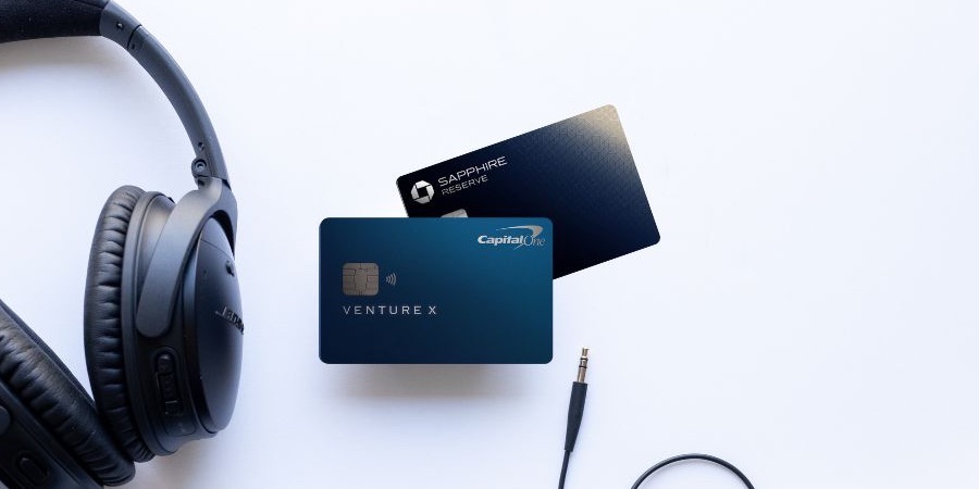 Capital One Venture X vs Chase Sapphire Reserve: Which Wins? Capital One Venture X and Chase Sapphire Reserve cards with a pair of headphones on a white background.