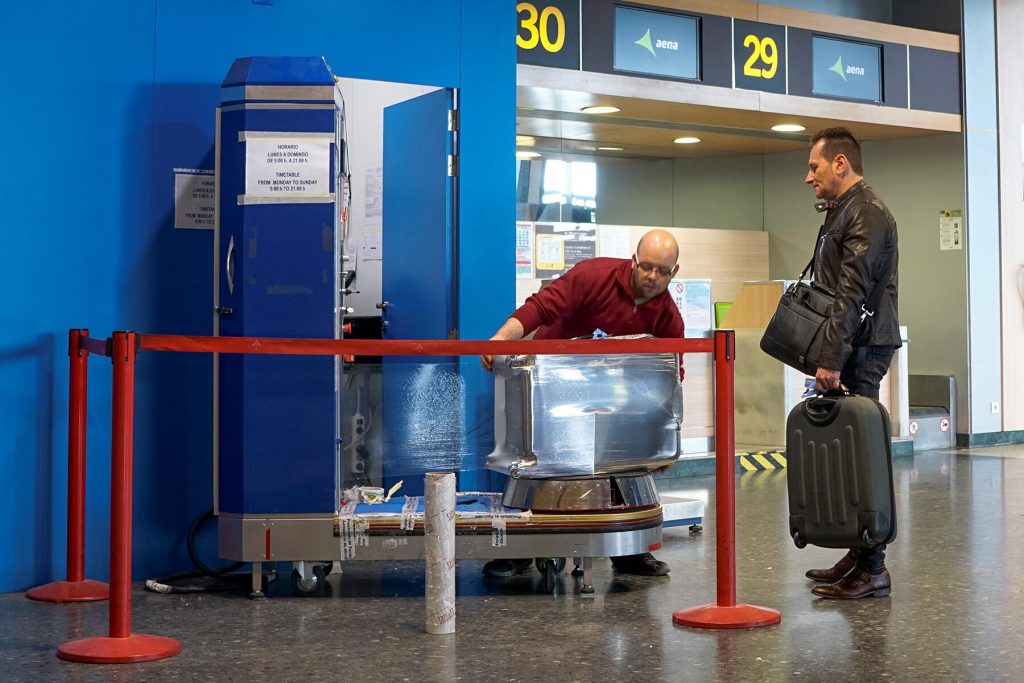 The Reason Why Travelers Will Shrink Wrap Their Luggage in Airports